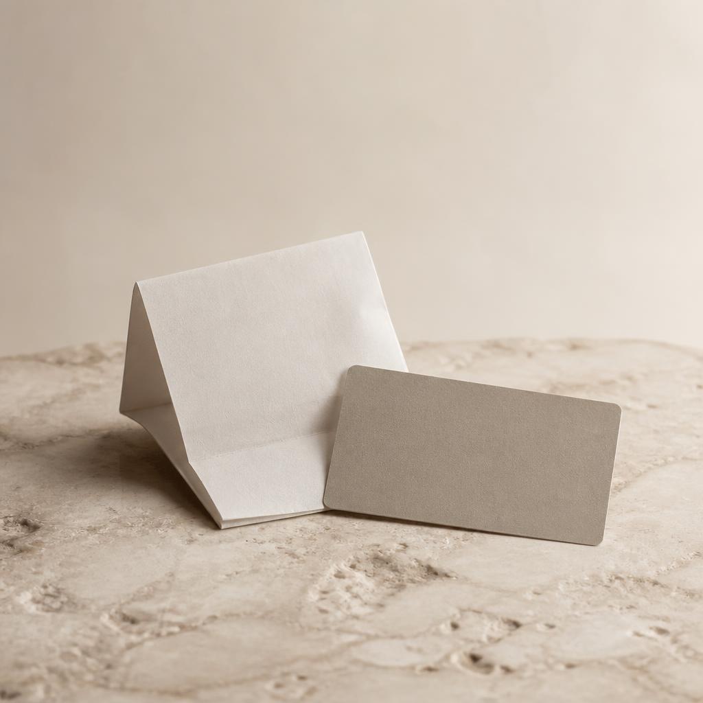 A folded receipt and warranty card on a stone counter — replaced by a single digital record